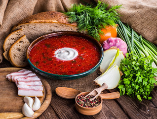 Ukrainian beetroot soup - borscht, on napkin, on wooden backgrou