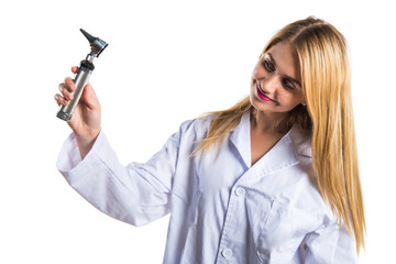 Doctor woman with otoscope