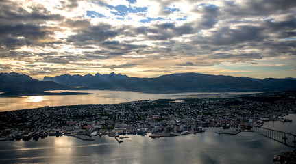 Sunset in the city of Tromso view from the top of Storsteinen in Norway.