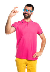 Man with colorful clothes holding something