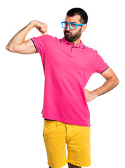 Man with colorful clothes making strong gesture