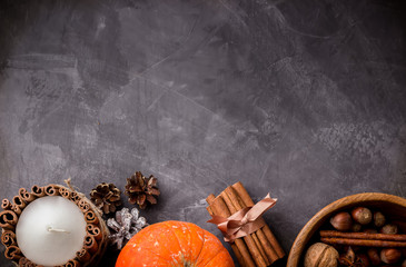  Fall harvest concept.Pumpkins, spices and nuts in wooden bowl.