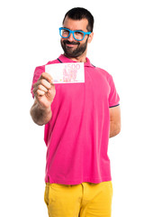 Man with colorful clothes taking a lot of money