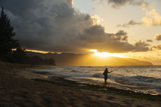 Fisherman at sunset, Oahu, Honolulu, Hawaii, United States of America 