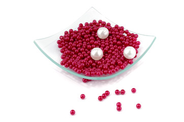 Nacreous plastic beads in square glass plate