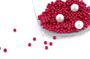 Nacreous plastic beads in square glass plate