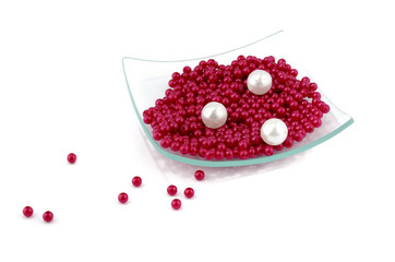 Nacreous plastic beads in square glass plate