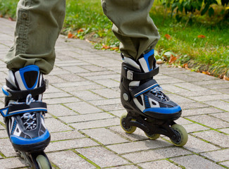 Roller skate legs close up in skatepark. Low section. Roller skates is extreme sport.