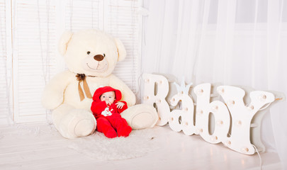 Cute baby with teddy bear