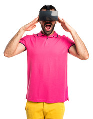 Man with colorful clothes using VR glasses