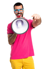 Man with colorful clothes shouting by megaphone