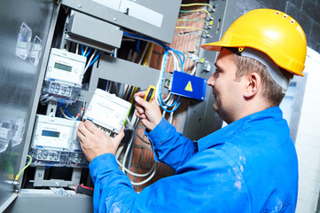 Electrician installing energy saving meter