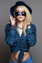 beauty hipster blond Sexy girl in hat and sunglasses.beautiful young woman