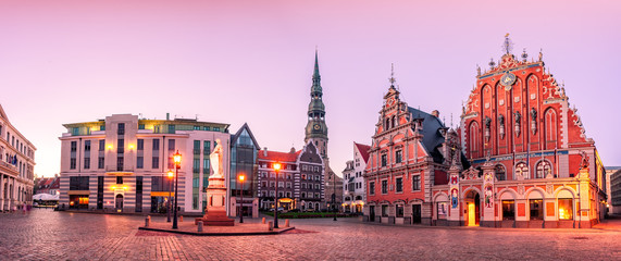 City Hall Square with House of the Blackheads and Saint Peter church in Riga Old Town During sunset...