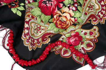 Fototapeta premium Thin wool kerchief and coral string of beads on white background