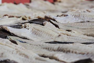 Dried split cod on racks in rural Newfoundland.