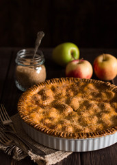 Traditional homemade apple pie on rustic background