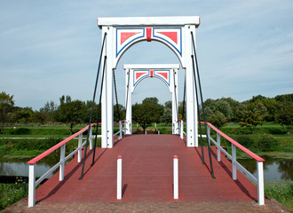 Fall at the old bridge in park