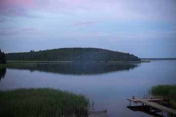 sunrise over a lake with island misty morning