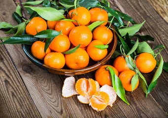 Fresh oranges on a wooden table