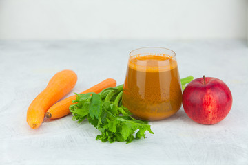 carrot juice in glass on  table