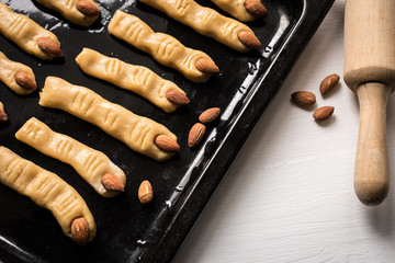 Halloween witch finger cookies for kids, funny recipe for Halloween party. Homemade cookies in the...