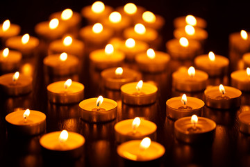 Many burning candles with shallow depth of field