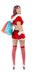 Beautiful Santa Claus woman holding shopping bags