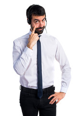 Fototapeta premium Young man with a headset showing something