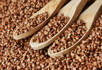 buckwheat groats and wooden spoon