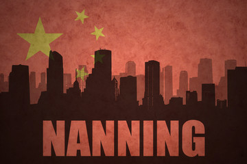 abstract silhouette of the city with text Nanning at the vintage chinese flag background