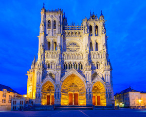 Notre-Dame of Amiens Cathedral. Vast, 13th-century Gothic edifice, famous for lavish decoration & carvings, with 2 unequal towers. - obrazy, fototapety, plakaty