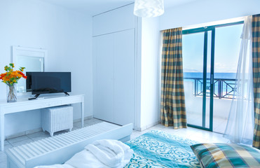 white room with window and sea views, resort island of Rhodes, Greece