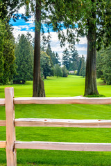 Golf course with wooden fence