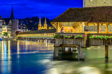 Night view towards Chapel Bridge (Kapellbruecke) together with the octagonal tall tower...