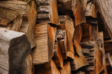 Fototapeta na wymiar Pile of chopped logs for firewood texture background in autumn, ready for winter