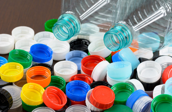 Multicolored bottle caps and plastic bottles.