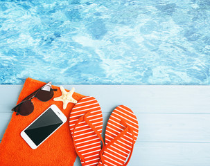 Summer beach set on swimming pool water background