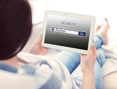 Pregnant woman with tablet. Children autism concept