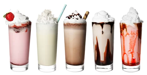 Wall murals Milkshake Glasses with delicious milk shakes on white background.