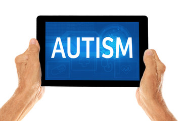 Children autism concept. Old man holding tablet on a white background