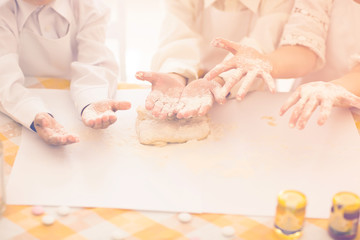Obraz na płótnie Canvas happy little children in the form of a chef to prepare delicious