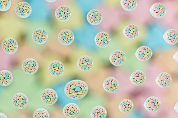 Colorful candies in the water drops.