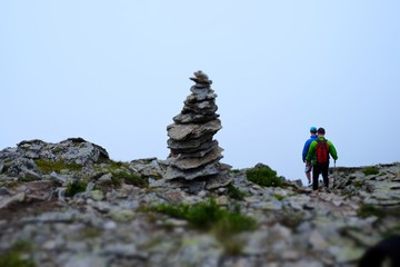 Tourists in the mountains in the mist