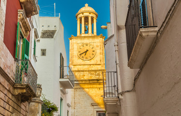 Locorotondo, clock tower and whitewashed houses