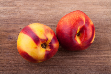 nectarines on wooden table..