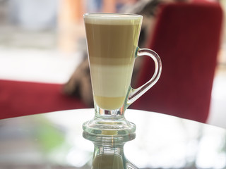 Coffee cup in the coffee shop, soft focus