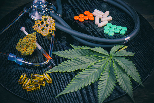 Medical marijuana products vs conventional pills concept
