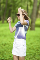 Teenagers Lifestyle Concepts. Portrait of Blond Caucasian Teenager Girl Posing Outdoors