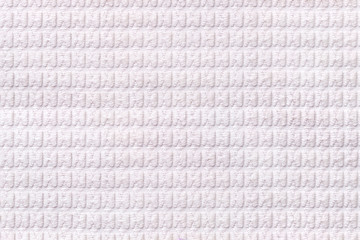White background from soft fleecy fabric close up. Texture of textiles macro.